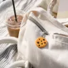 Orange cookie-shaped pendant, cute dessert-style keychain decoration details Picture
